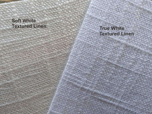 Two samples of textured linen fabric labeled 'Soft White' and 'True White'.