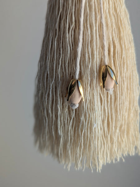 tassel with brass and wooden decorative elements 