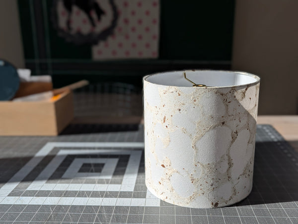 modern pebbled paper lampshade with textured paper in white and cream colorway