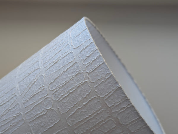 white textured paper lamp shade with geometric pattern 