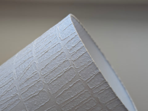 white textured paper lamp shade with geometric pattern 