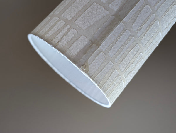 white textured paper lamp shade with geometric pattern 