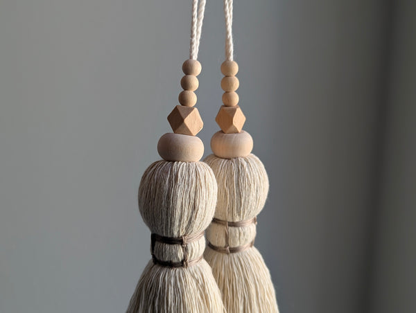 oversized modern boho tassel in cotton with wooden beads and a brass bell