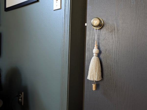 oversized modern boho tassel in cotton with wooden beads and a brass bell