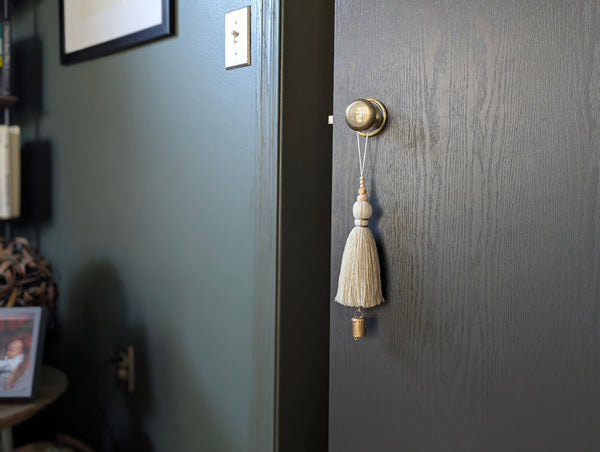oversized modern boho tassel in cotton with wooden beads and a brass bell