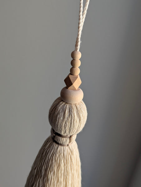 oversized modern boho tassel in cotton with wooden beads and a brass bell