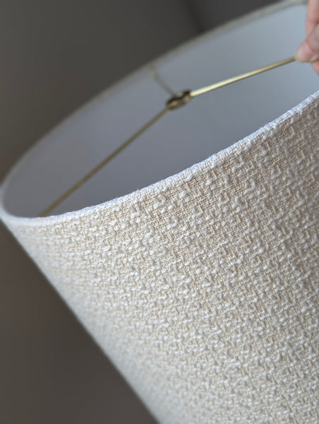 mid-mod boucle fabric lamp shade close up with spider washer hardware