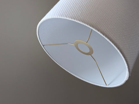 Close-up of the white crosshatch lamp shade with euro fitter