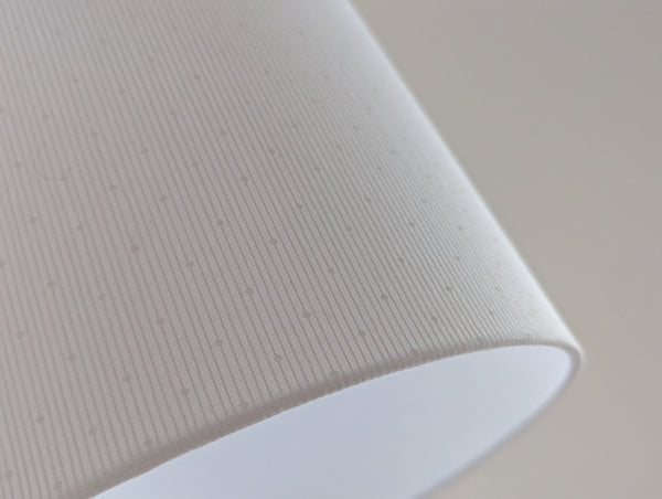 white lamp shade with subtle polka dot pattern