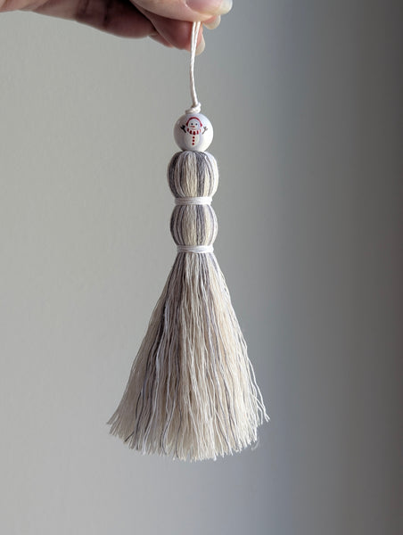 tassel gift tag or stocking charm in gray and white with a snowman bead