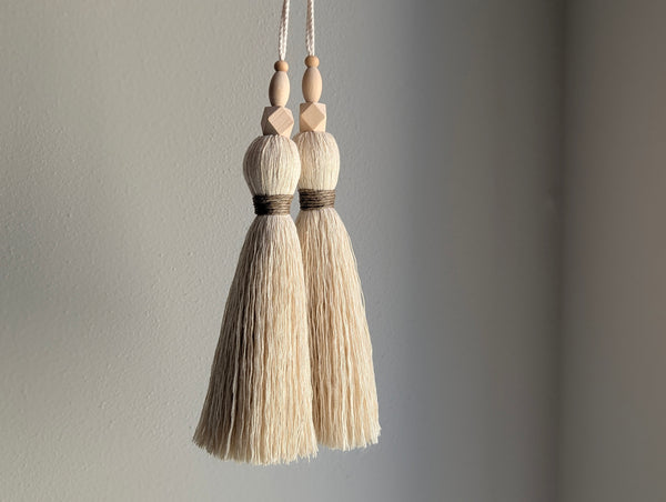 large double tassel with wooden beads and tan twine for hanging on door knobs or cabinet knobs