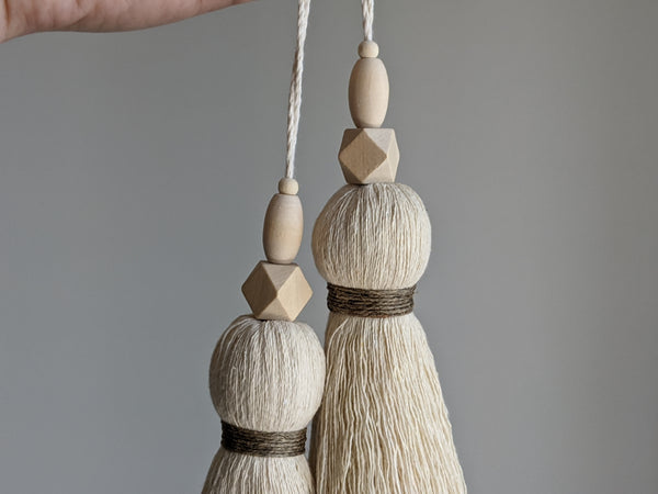 large double tassel with wooden beads and tan twine for hanging on door knobs or cabinet knobs