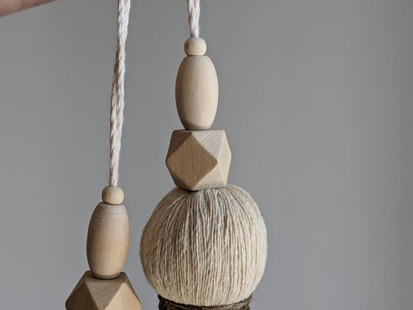 large double tassel with wooden beads and tan twine for hanging on door knobs or cabinet knobs