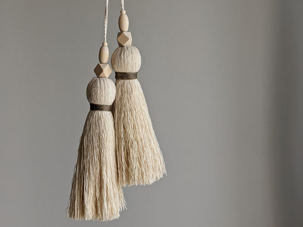 large double tassel with wooden beads and tan twine for hanging on door knobs or cabinet knobs
