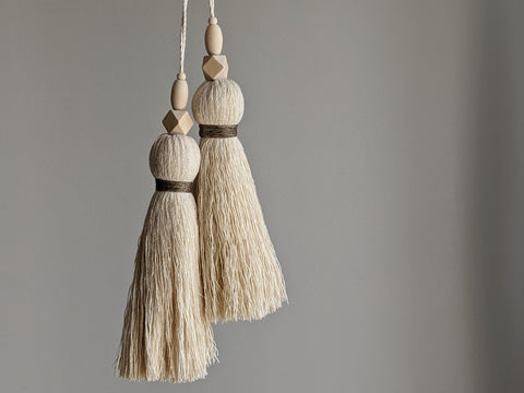large double tassel with wooden beads and tan twine for hanging on door knobs or cabinet knobs