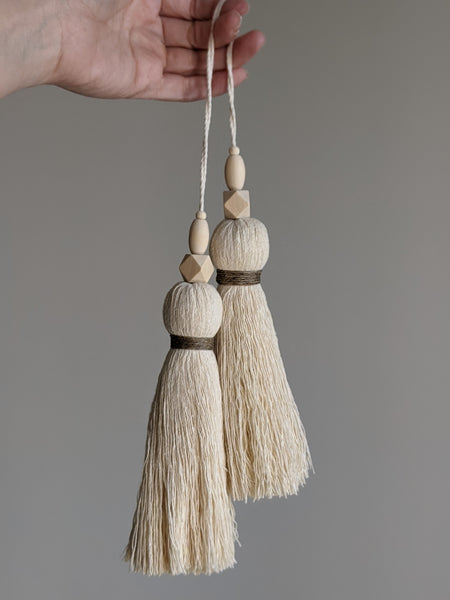 large double tassel with wooden beads and tan twine for hanging on door knobs or cabinet knobs