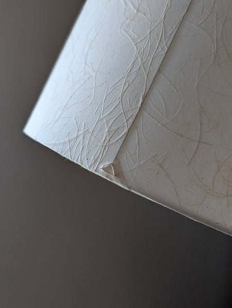 mulberry paper lampshade with textured paper in cream color and triangle stitch detail on the back seam
