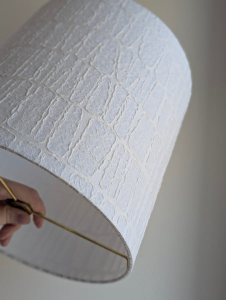 white textured paper lamp shade with geometric pattern 