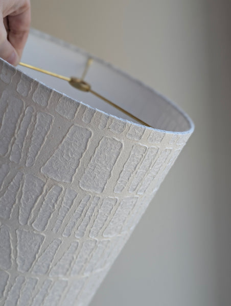 white textured paper lamp shade with geometric pattern 