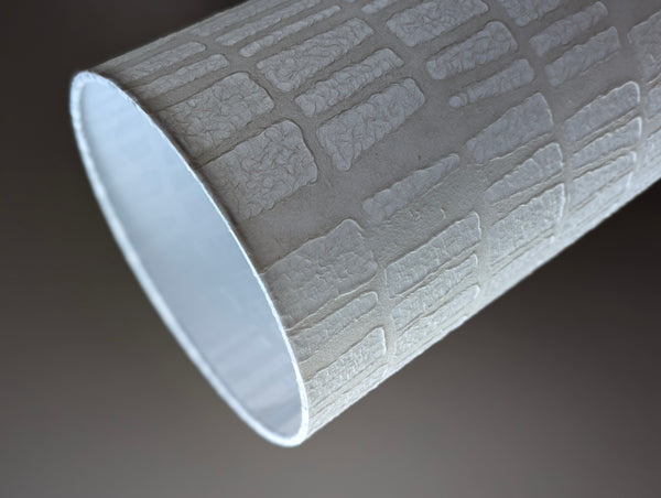 white textured paper lamp shade with geometric pattern 