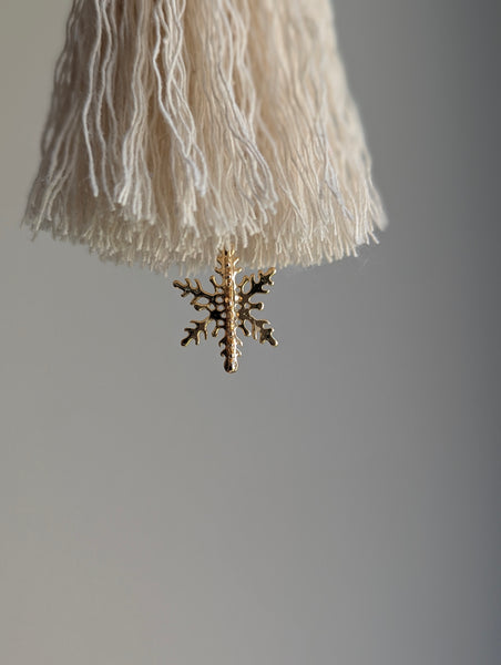 snowy white snowflake tassel with white speckled glass bead and brass snowflake charm