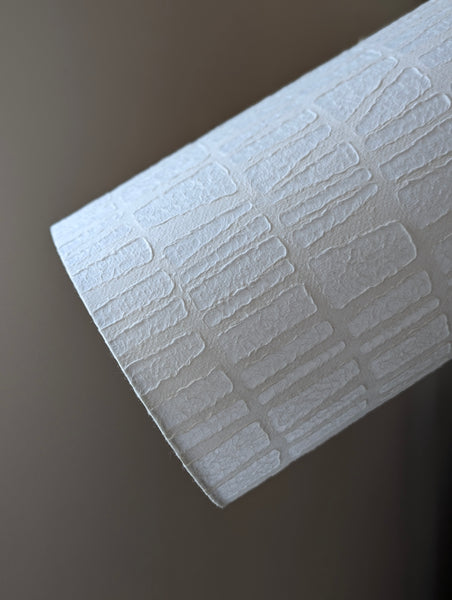 white textured paper lamp shade with geometric pattern 