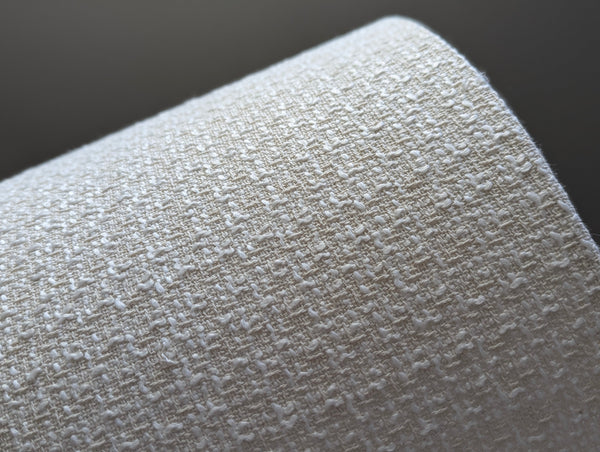 mid-mod boucle fabric lamp shade close up with spider washer hardware