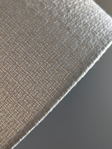 mid-mod boucle fabric lamp shade close up with spider washer hardware