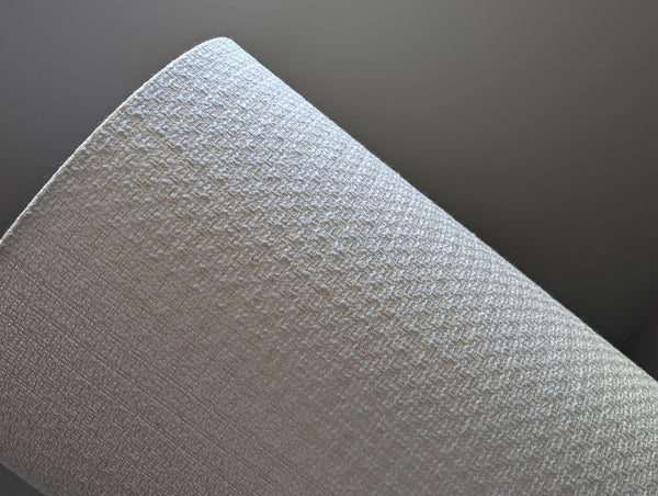 mid-mod boucle fabric lamp shade close up with spider washer hardware