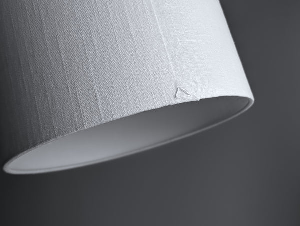 close up of back seam of drum shade in True White Textured Linen with triangle stitch detail at the bottom of the shade