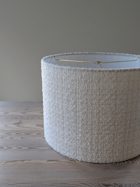 highly textured lampshade in ivory boucle tween on a wooden table