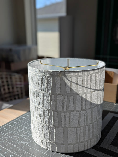 white textured paper lamp shade with geometric pattern 