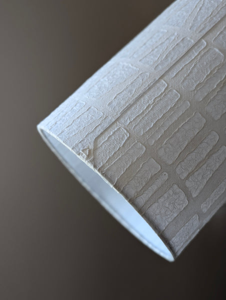 white textured paper lamp shade with geometric pattern 