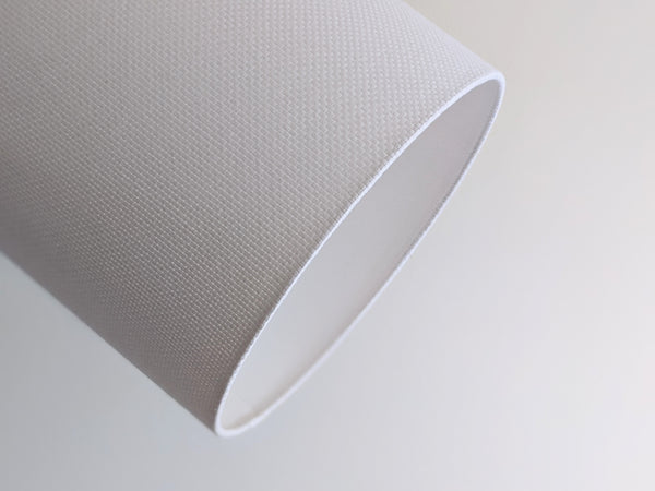 close up of back seam in an Ud Form White Crosshatch Lamp Shade showing the signature triangle stitch detail in white pearl cotton