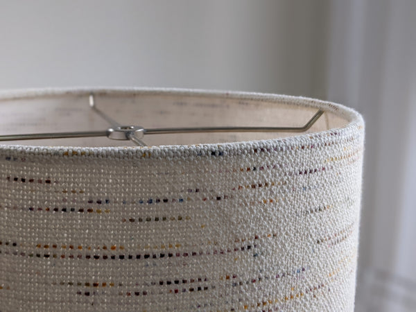 close up image of top edge of Handwoven Confetti Fabric Lamp Shade with nickel finish hardware