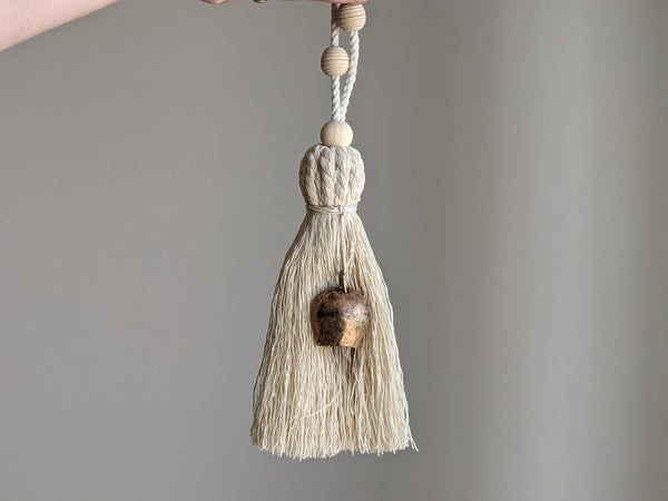 Textured home decor tassel with cotton rope, rustic bell, and wooden beads