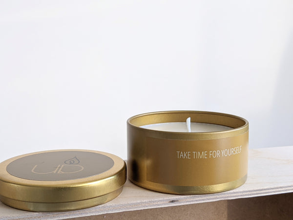 Cotton wick, gold candle sitting on a wooden shelf, labelled 'Take Time for Yourself'