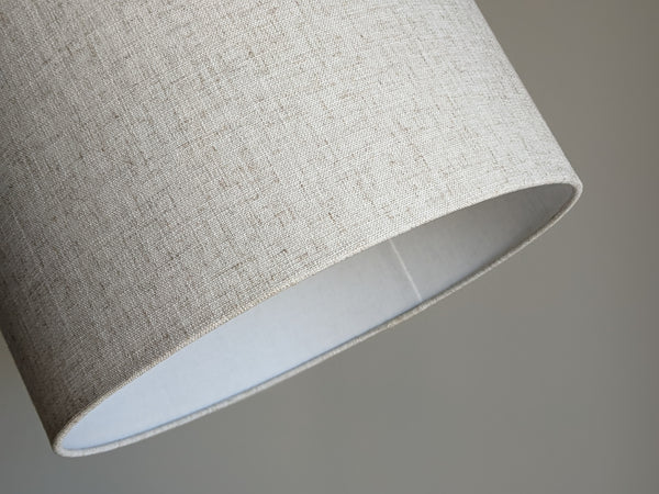 close up of bottom edge of handmade lamp shade in Calacatta Gold Flax fabric