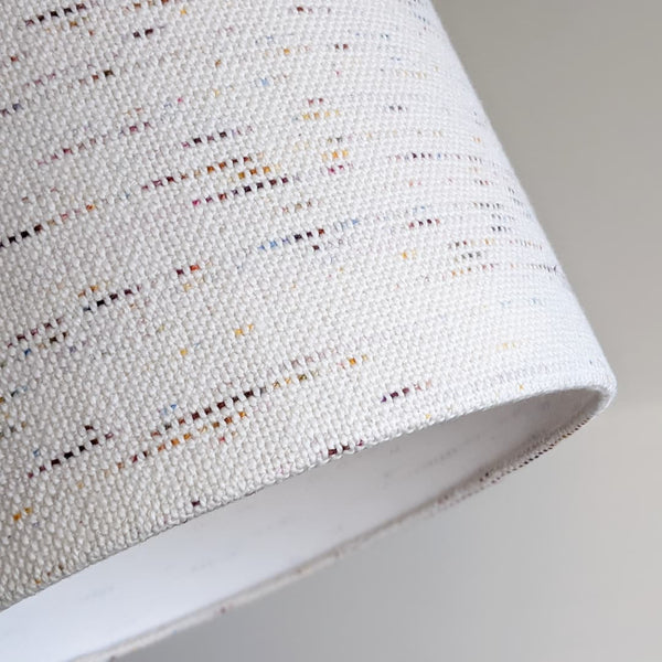 a close up image of bottom edge of Handmade Confetti Fabric Lamp Shade
