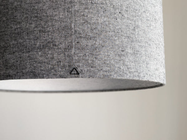 close up of the black triangle stitch detail on the back seam of this handmade lamp shade