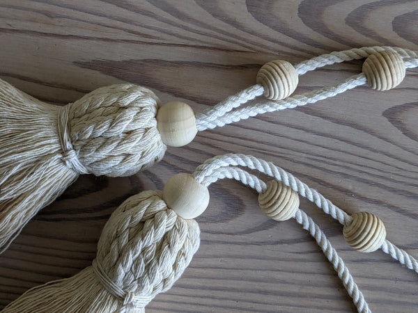 Close up of wooden beads on tassel loops